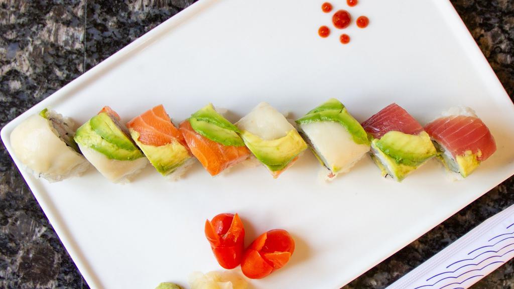 Rainbow Roll · Cucumber, avocado, crab meat inside top with tuna, salmon and white fish.