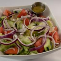 Garden Salad · Iceberg lettuce, tomatoes, onions, and cucumbers.