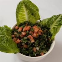 Tabbouleh · Chopped parsley, cracked wheat, tomatoes, onions, mint, lemon juice, and olive oil.