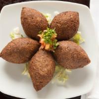 Kibbe Balls · Cracked wheat balls stuffed with sautéed ground beef and onions, fried (by piece).