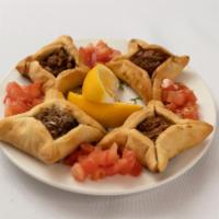 Meat Pie (4) · Finely ground and seasoned mini beef pies stuffed in warm dough.