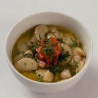 Lima Beans · Cooked lima beans, made with fresh garlic, fresh lemon juice, olive oil, and parsley.