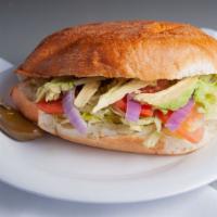 Tortas Mexicanas · Bread and your choice of meat served with avocado, tomato, cucumber, mayonnaise, and jalapeñ...
