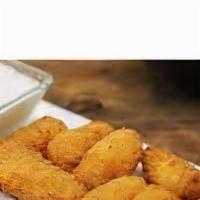 Smoked Gouda Mac & Cheese Bites · battered sized nuggets packed with a creamy gouda mac & cheese