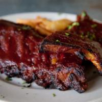 Slow-Roasted Bbq Ribs · Steak fries and coleslaw.