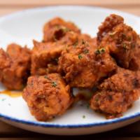 Fried Chicken Bites · Tossed in a choice of mesquite bbq, traditional buffalo, old bay or smoked chipotle dry rub ...