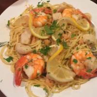 Shrimp Scampi · Six sautéed shrimp and garlic in a lemon wine sauce, topped with baby shrimp