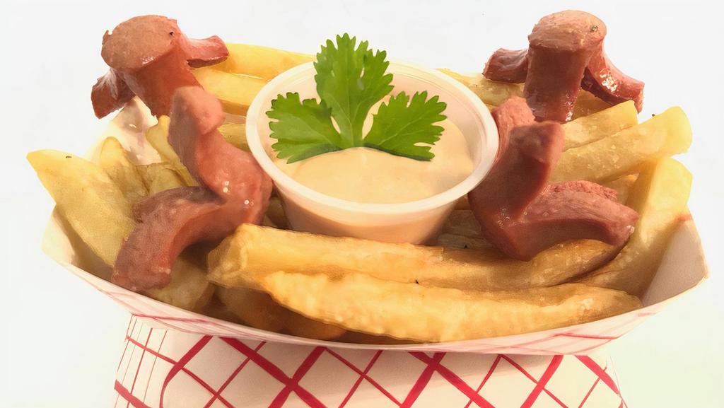 Salchipapas  · A basket of fries with fried hotdogs.