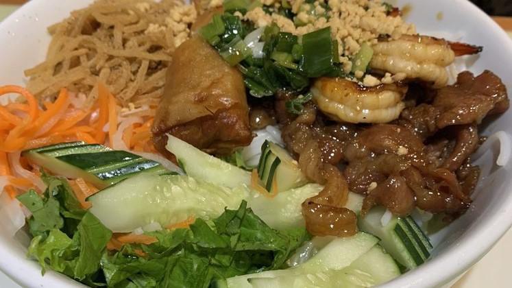 Bun Dac Biet · House special rice vermicelli with combination of spring rolls, shredded pork, charbroiled pork, and shrimp on vermicelli. Served with lettuce, cucumber, fish sauce, and ground peanuts.