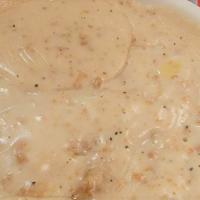 Sausage Gravy · Served over biscuits with potatoes.