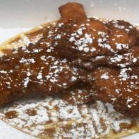Chicken N Waffle · 3 honey glazzed chicken tenders on top of a belgian waffle topped with butter and sugar