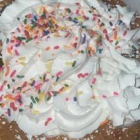 Confetti  Pancakes · 2 pancakes with rainbow sprinkles. topped with whipped cream