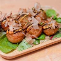 Takoyaki 6 Pieces · Japanese mountain-potato encrusted octopus topped with bonito flakes, Japanese mayo and barb...