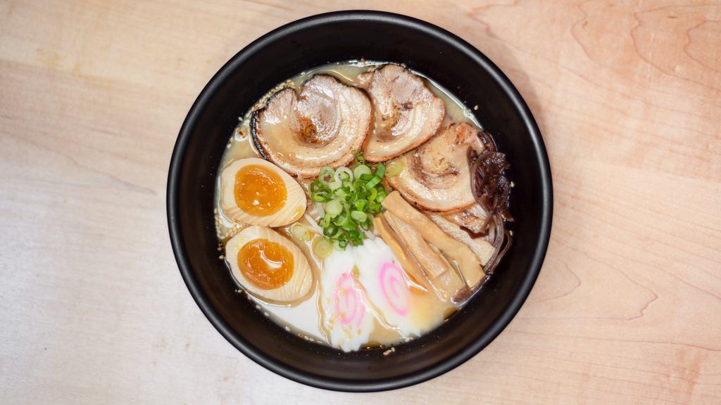 Miso · Pork and chicken broth with miso paste and wavy egg noodle topped with roast pork (chashu), bamboo shoot, kikurage mushroom, bean sprout, sesame seed, scallion and seasoned boiled egg.