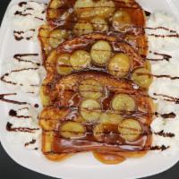 Caramelized French Toast · Three slices of cinnamon battered French toast topped with our specialty caramel sauce, slic...