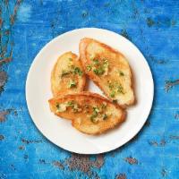 Garlic Bread · Bread topped with garlic and olive oil or butter and include additional herbs oregano or chi...
