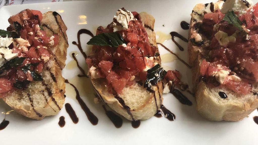 Bruschetta · Toasted Slices of Our Delicious Homemade Italian Bread topped with our Blend of Diced Tomatoes, Garlic, and Basil.