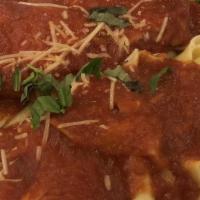Chicken Parmigiana · Topped with Mozzarella Cheese, Tomato Sauce, Served with a Side of Spaghetti.
