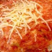 Lasagna · A Tradition of Pasta, Meat, Ricotta Cheese, Mozzarella Cheese, Tomato Sauce.