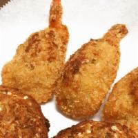 Stuffed Shrimp (6) · Crispy fried jumbo shrimp, topped with real jumbo lump crabmeat, served with two side dishes...