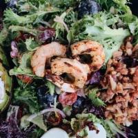 Wharf Louis · lump crab meat, grilled wild shrimp, grilled avocado, bacon, gourmet greens, cucumbers, cher...