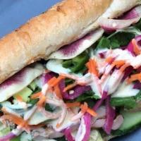 Sweet & Spicy Banh Mi · toasted baguette, teriyaki chicken thigh, pickled carrots & onions, cucumber, lettuce, jalap...