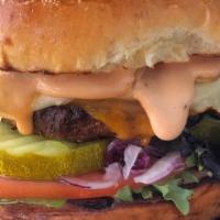 Classic Burger · toasted brioche bun, house blend char-grilled beef burger, cheddar & American cheese, carame...