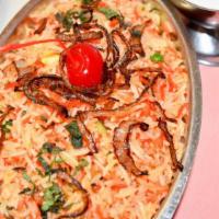 Shrimp Biryani · Saffron flavor Basmati rice cooked with shrimp, vegetables, Indian spices
and toasted nuts a...