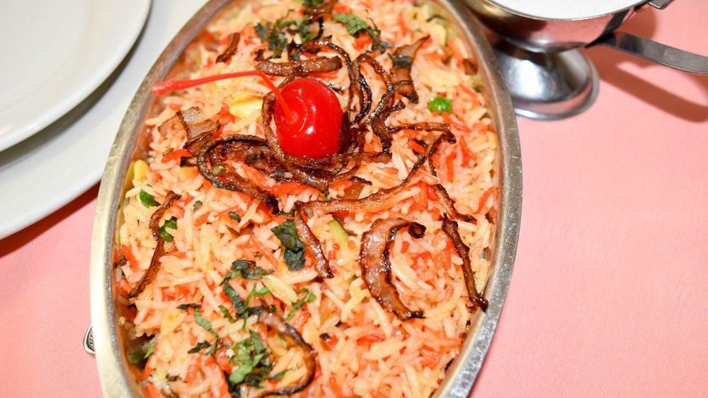 Shrimp Biryani · Saffron flavor Basmati rice cooked with shrimp, vegetables, Indian spices
and toasted nuts and raisins.