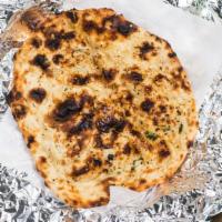 Garlic Naan · Leavened handmade bread with a touch of garlic.