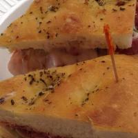 Hot Italiano Sandwich · Hot capoco ham, pepperoni, salami, green peppers, hot peppers, onions, Italian dressing with...