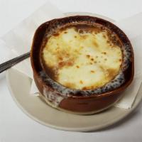 French Onion Soup · Baked with homemade croutons and melted Mozzarella cheese.