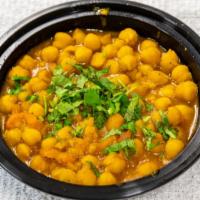 Chhole - Chickpeas And Rice · Vegetarian. Chhole - chickpeas and rice (16oz): onion and tomato sauce, cumin seeds, cloves,...