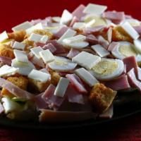 Chef Salad · Garden salad with croutons, ham, honey smoked turkey, hard boiled eggs and American cheese.