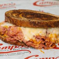 Corned Beef Ruben · Corned beef brisket grilled in sauerkraut, Russian dressing and topped with Swiss cheese.   ...
