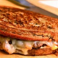 Patty Melt · 8 ounce short rib burger served on swirl rye toast with grilled onions and American and Swis...