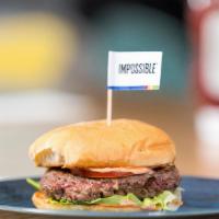 Impossible Burger Deluxe · Delicious burger made from plants.  Served with lettuce tomato and grilled onions.