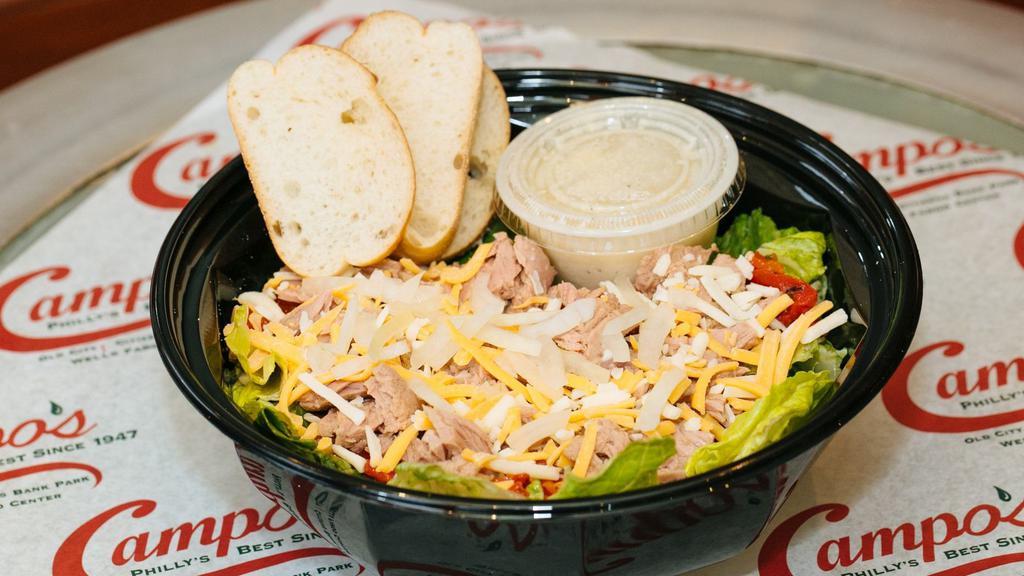 Mom'S Salad · Fresh romaine lettuce and Italian tuna packed in olive oil are tossed in our own Caesar dressing.  Then we top it with, mozzarella cheese, sweet roasted peppers, and raw onions