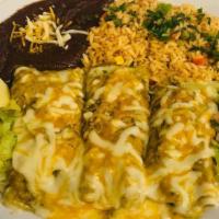 Enchiladas Verdes · Chicken. Enchiladas are served with rice and beans.