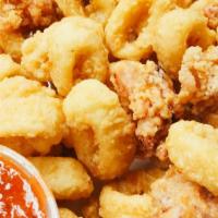 Fried Calamari · Lightly breaded calamari, tender in the inside and crispy fried to golden brown perfection, ...
