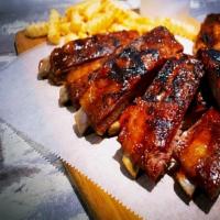 Bbq Ribs (3) · Juicy and tender BBQ pork ribs, served with choice of two side dishes and choice of bread.