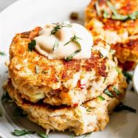 Crab Cakes (1) · One fried crab cake, made with real jumbo lump crab meat, served with choice of two side dis...
