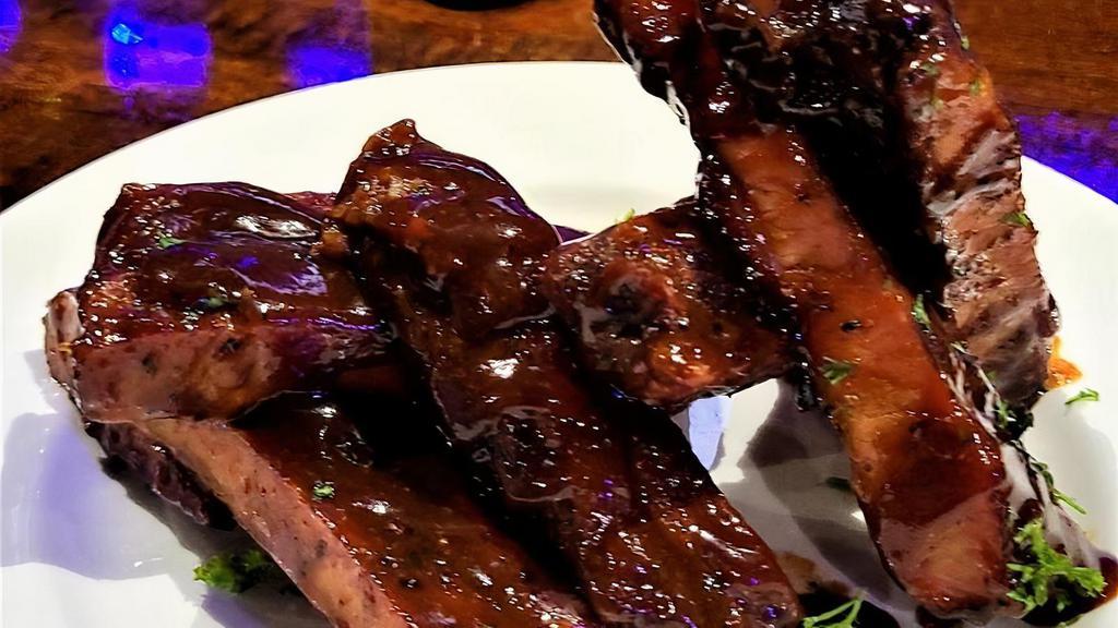 Ribs, Half Rack · Locally sourced Pork Ribs, dry rubbed & slow smoked. Served dry or BBQ glazed.