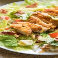 G2- Panko Chicken Cobb Salad  W. Ranch Dressing · Panko chicken tender  nuggets sliced and served hot on 
        a fresh bed of  greens, with...