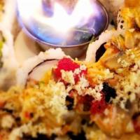 Volcano · Baked mixed chopped seafood, mushroom, creamy scriracha, California roll, tobikos, flaming l...