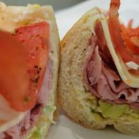 American Hoagie* · Comes standard with Lettuce, Tomato, Raw onions and oregano.

Cooked salami, Ham and provolo...
