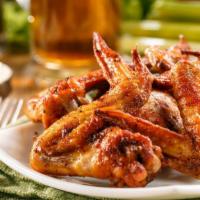 Hot Wings · Fresh baked jumbo chicken wings tossed in a hot sauce. Comes with your choice of dipping sau...