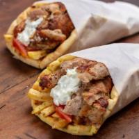 Ny Style Lamb & Chicken Gyro Wrap · A hearty gyro made with roasted well marinated lamb and chicken with lettuce, tomato, onion ...