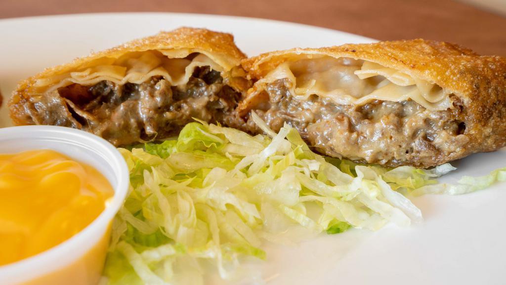 Cheesesteak Egg Rolls (2) · Steak and cheese stuffed in egg roll, come with lettuce, cheese and sauce.