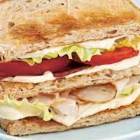 Turkey Club · Fresh sliced Turkey Breast, Bacon, Lettuce and Tomato on toasted White Bread with Mayo. Serv...
